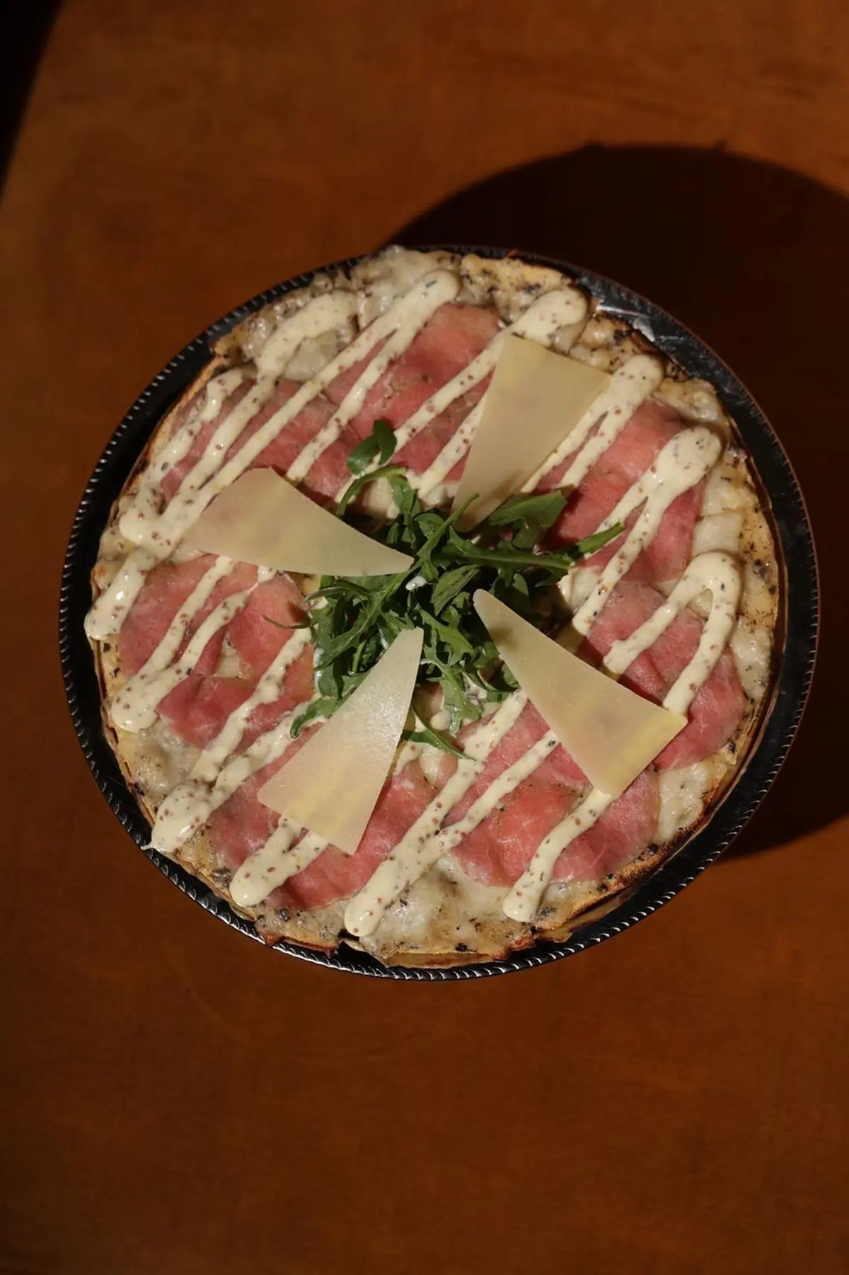 Pizzette with beef carpaccio & truffle parmesan sauce